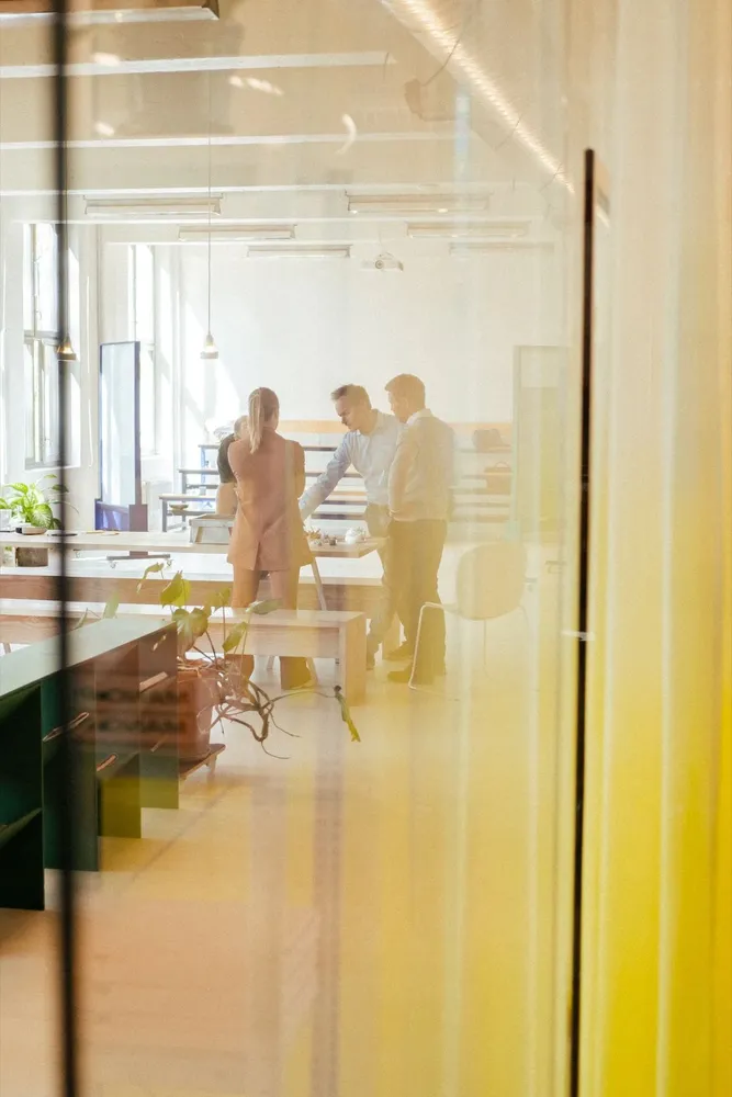 An open-plan studio seen through a glass wall